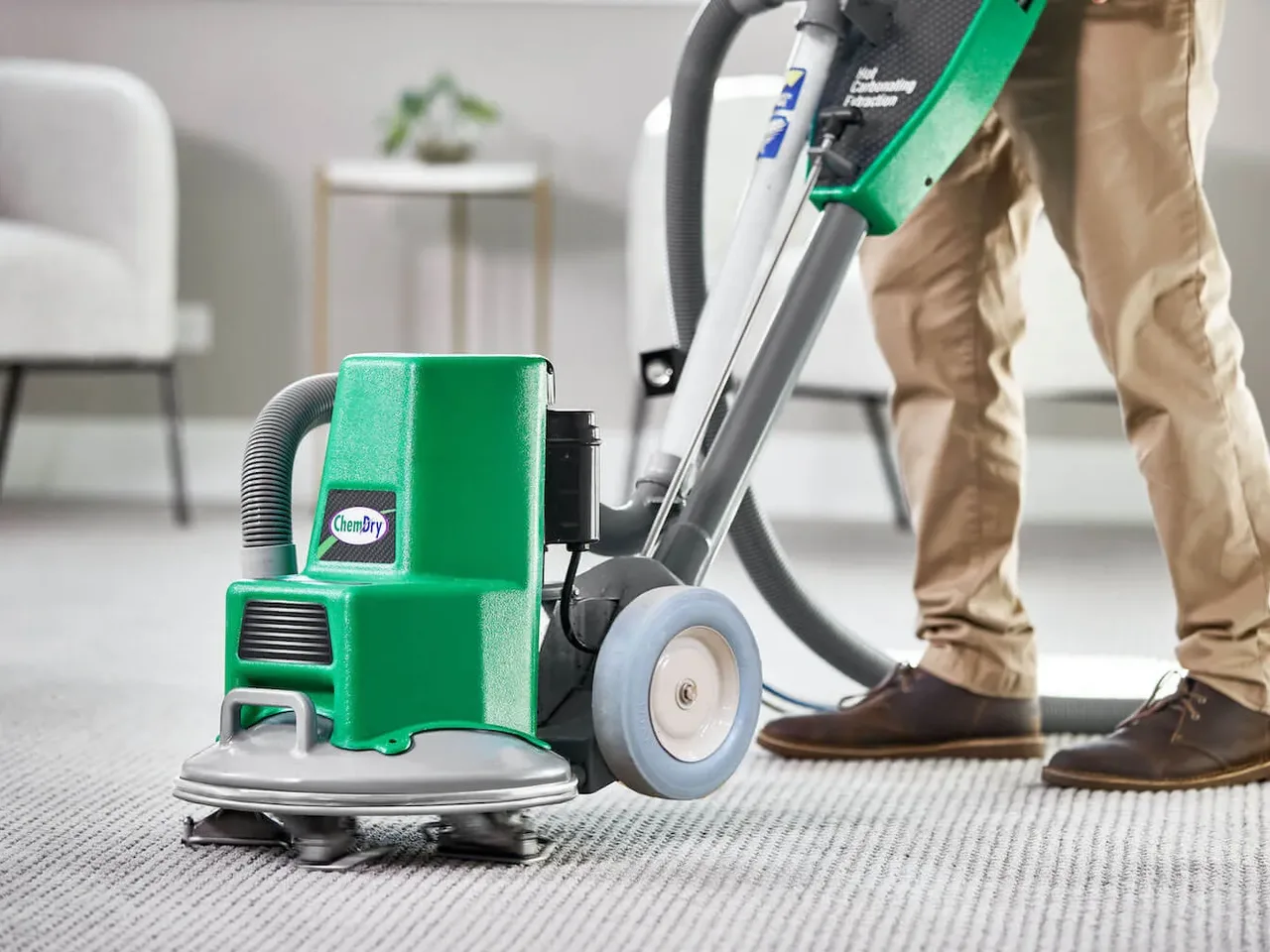 Chem-Dry technician cleaning a living-room carpet