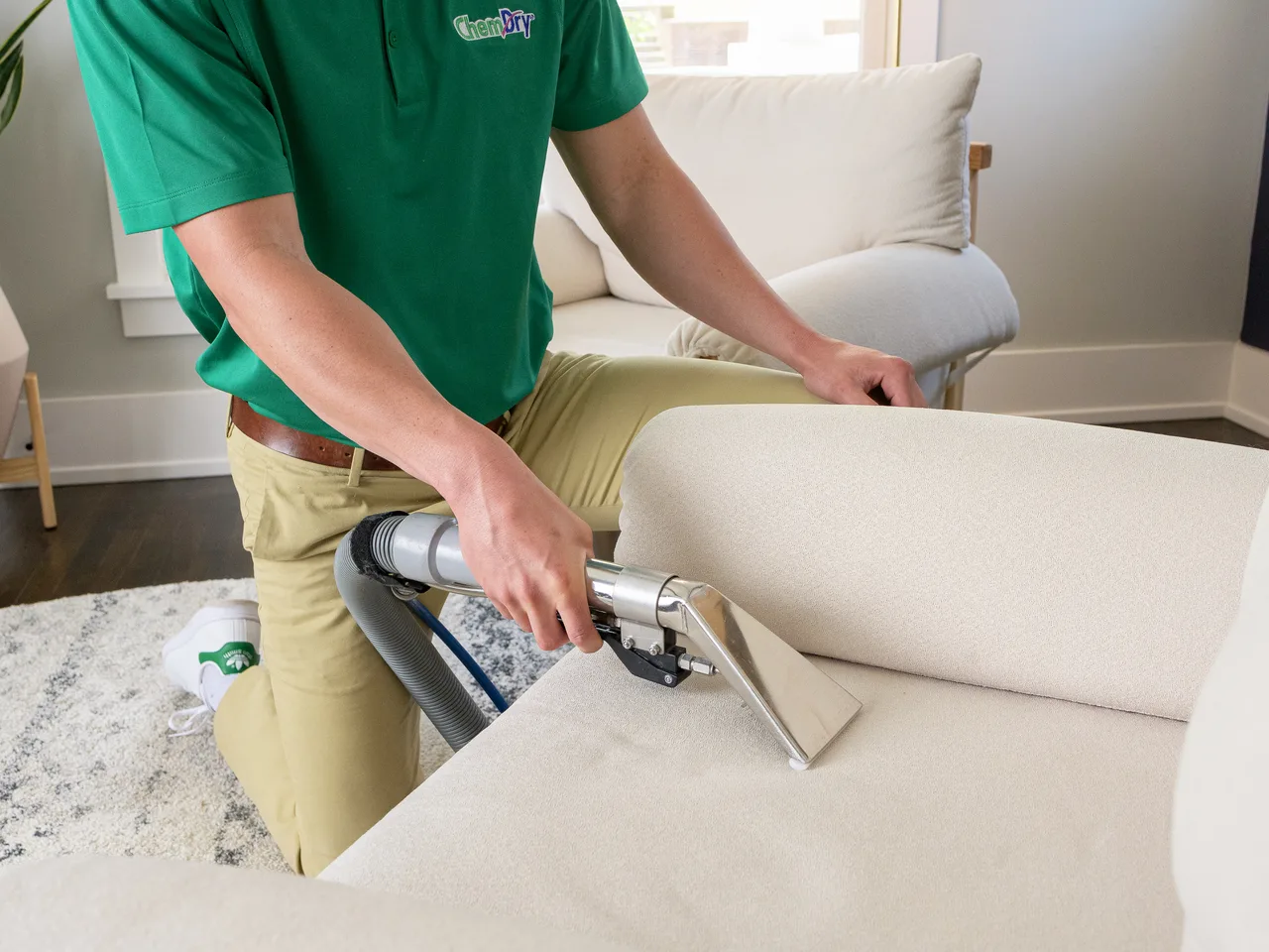 Chem-Dry technician cleaning an upholstered cushion